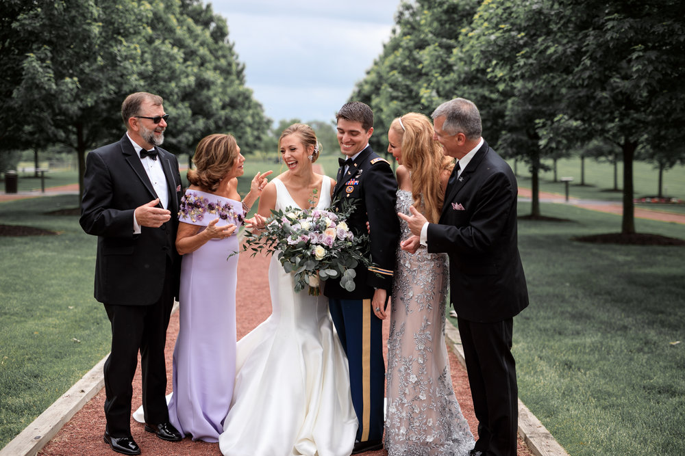 Bride-and-groom-with-family-on-wedding-day.jpg