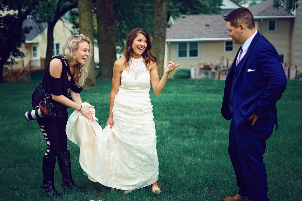 Lauren ashley grenda wedding photographer cleaning dress