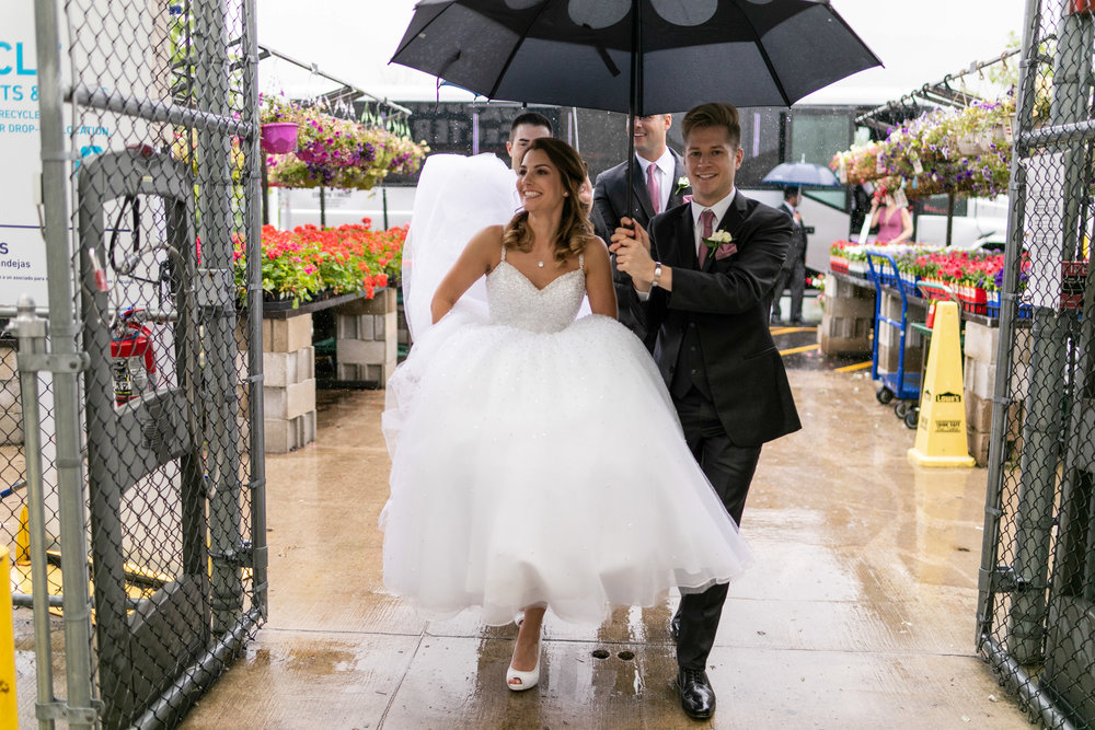 Wedding couple takes photos at lowes hardware due to rain