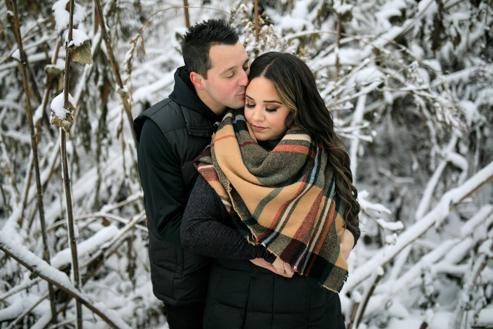 best winter engagement photographer takes couple oustide for winter wonderland photoshoot