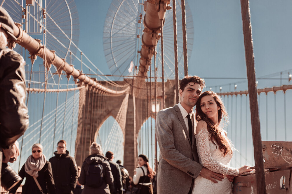 engagement photo on suspension bridge by the best wedding photography company lauren ashley studios